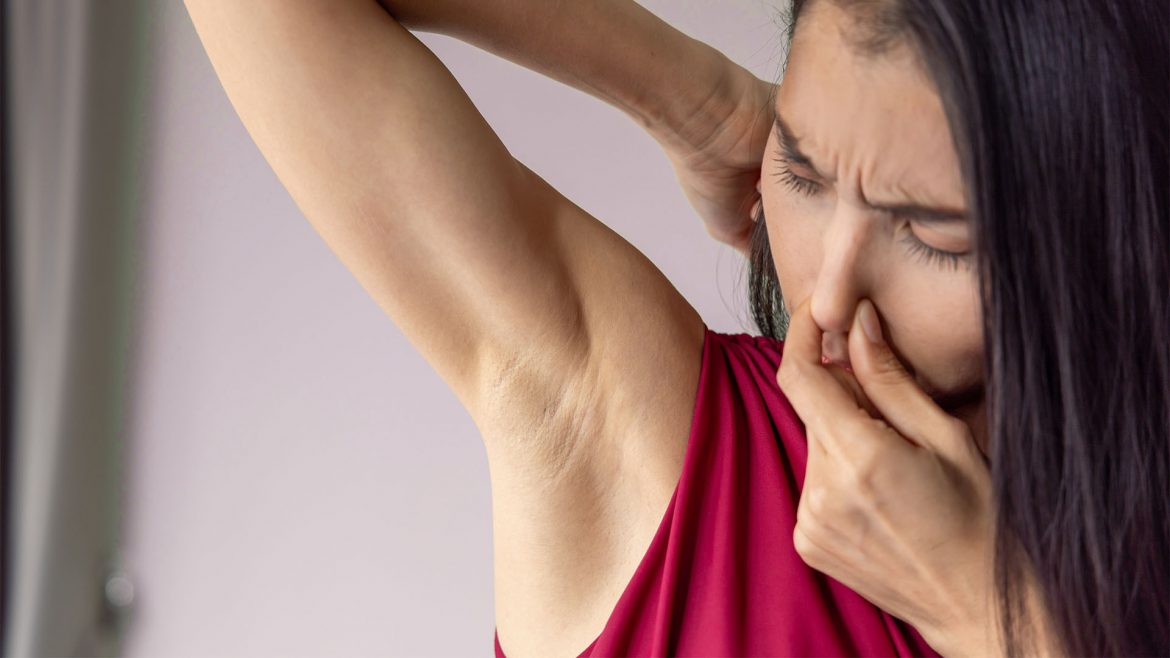 Woman with sweaty and smelly underarm