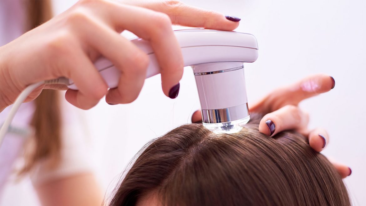 A woman getting hair treatment