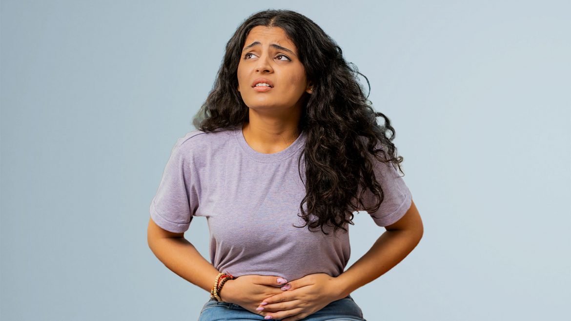 A woman suffering from cramps during her periods.