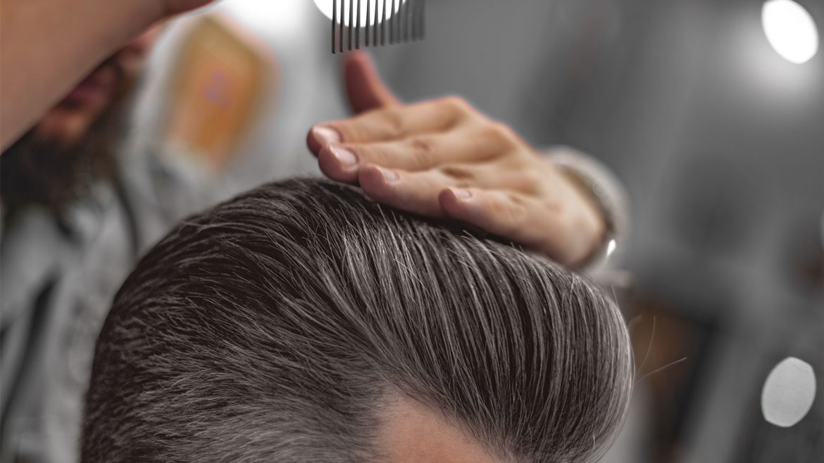 Men getting a hair style that suits his oval face