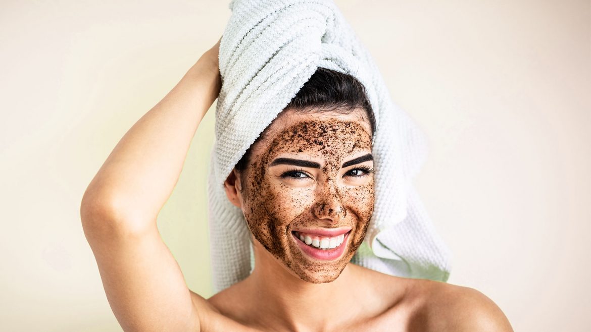 A woman with coffee mask on her face