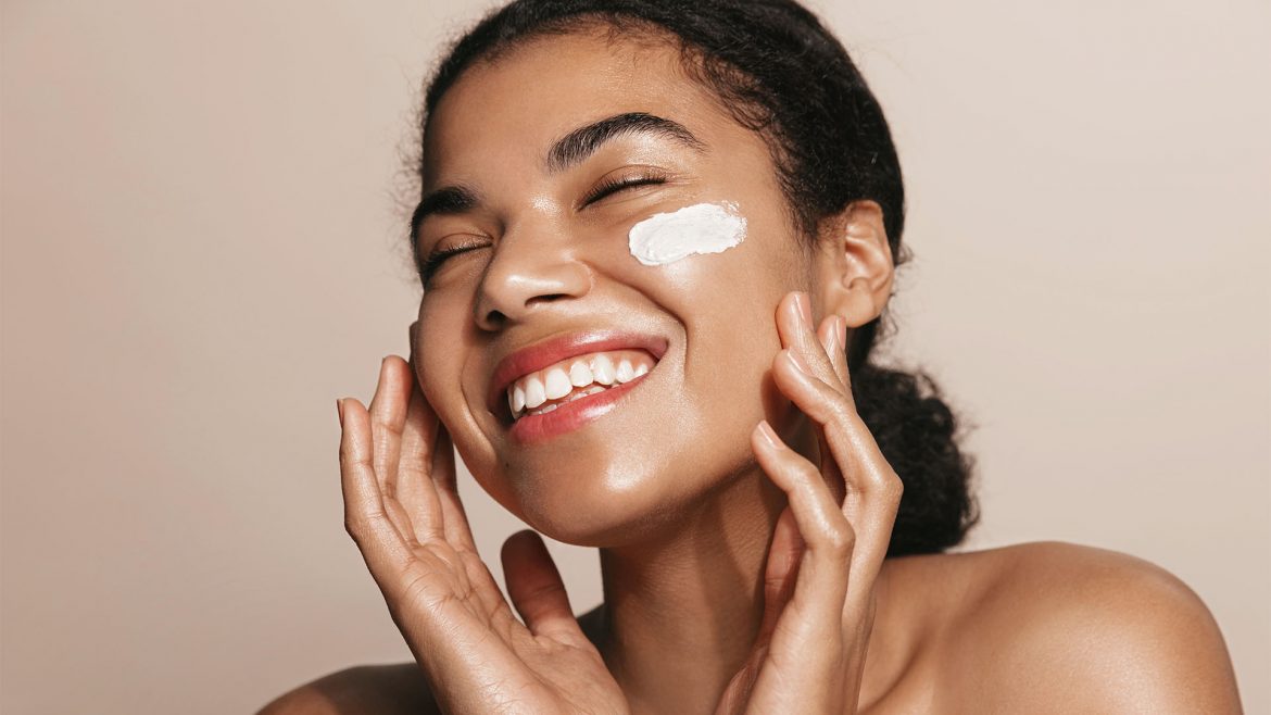 Woman with kojic acid cream on her face