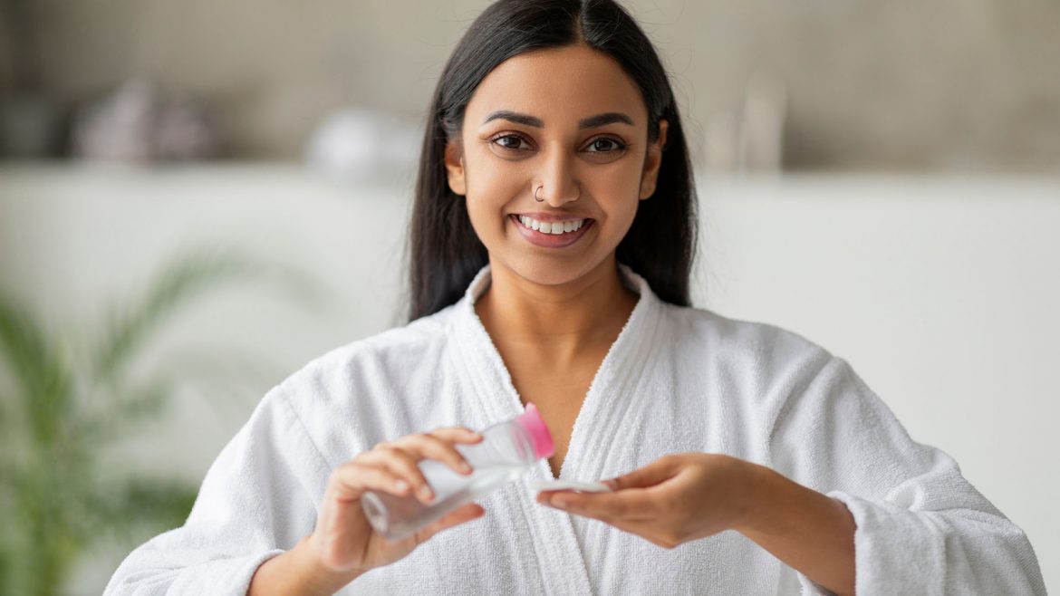 Woman using face toner