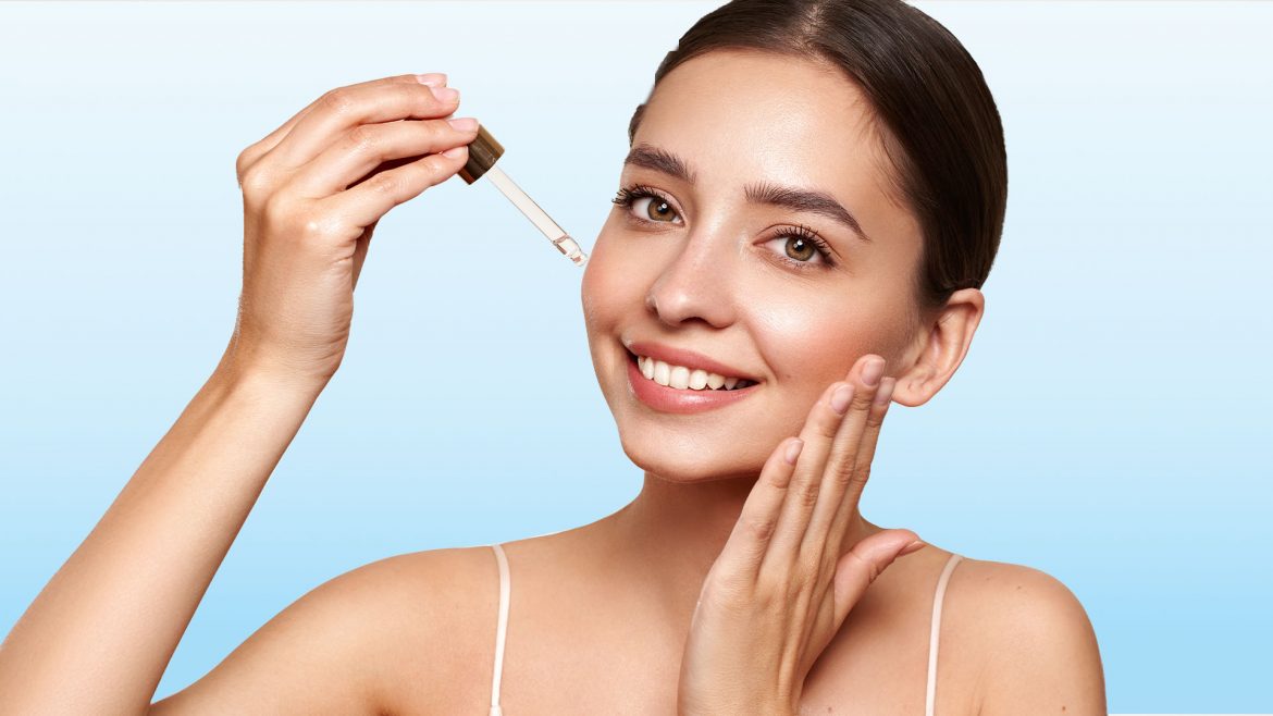 Woman applying glycerin on her face at night