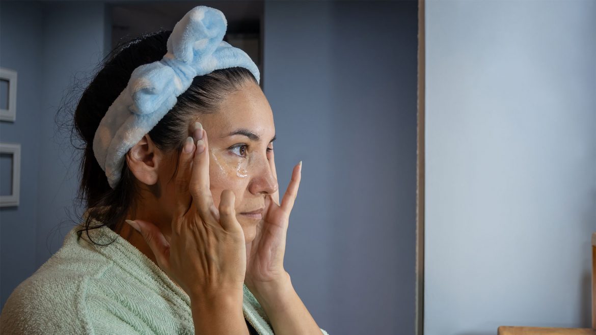 Woman applying active skincare during the night