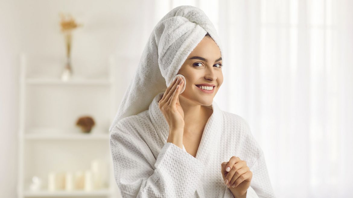 Woman using face toner