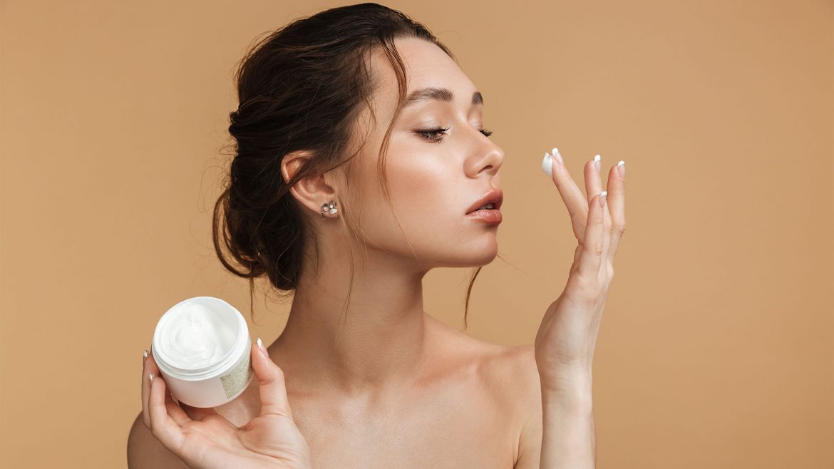 Woman using Kojic acid cream