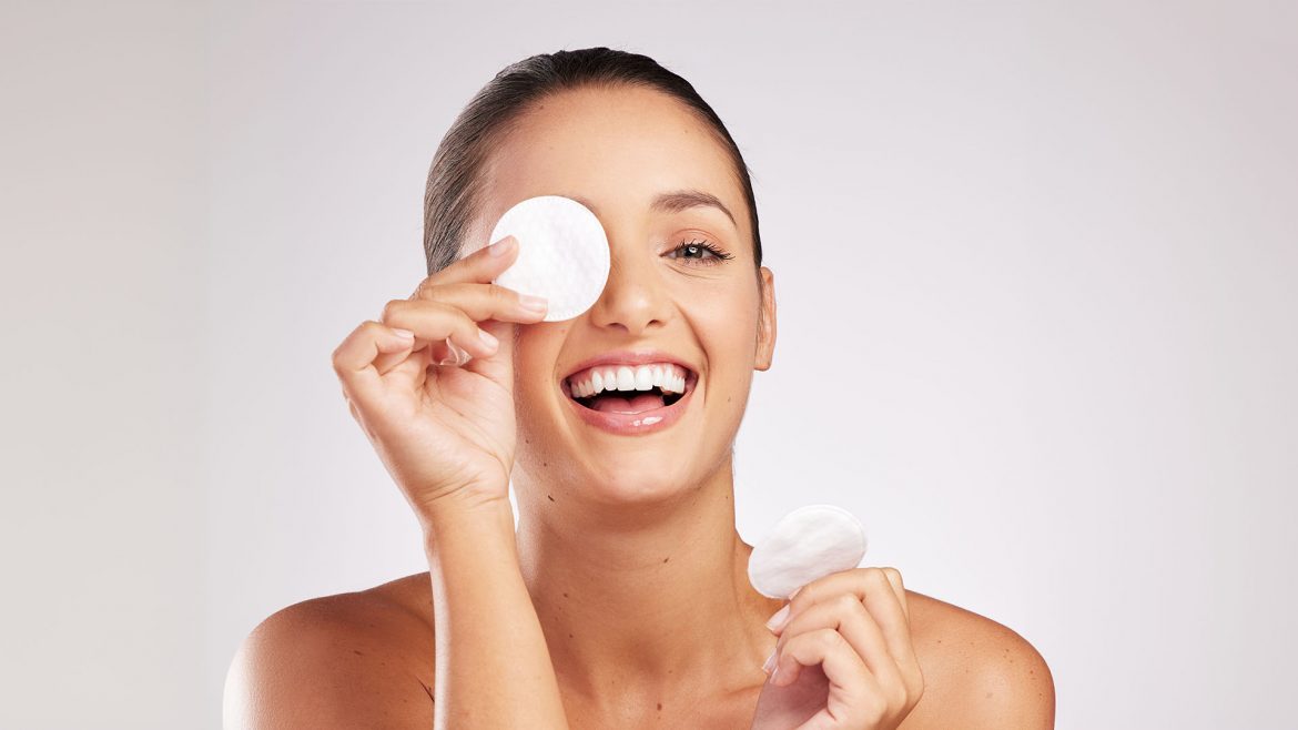 Woman applying face toner 