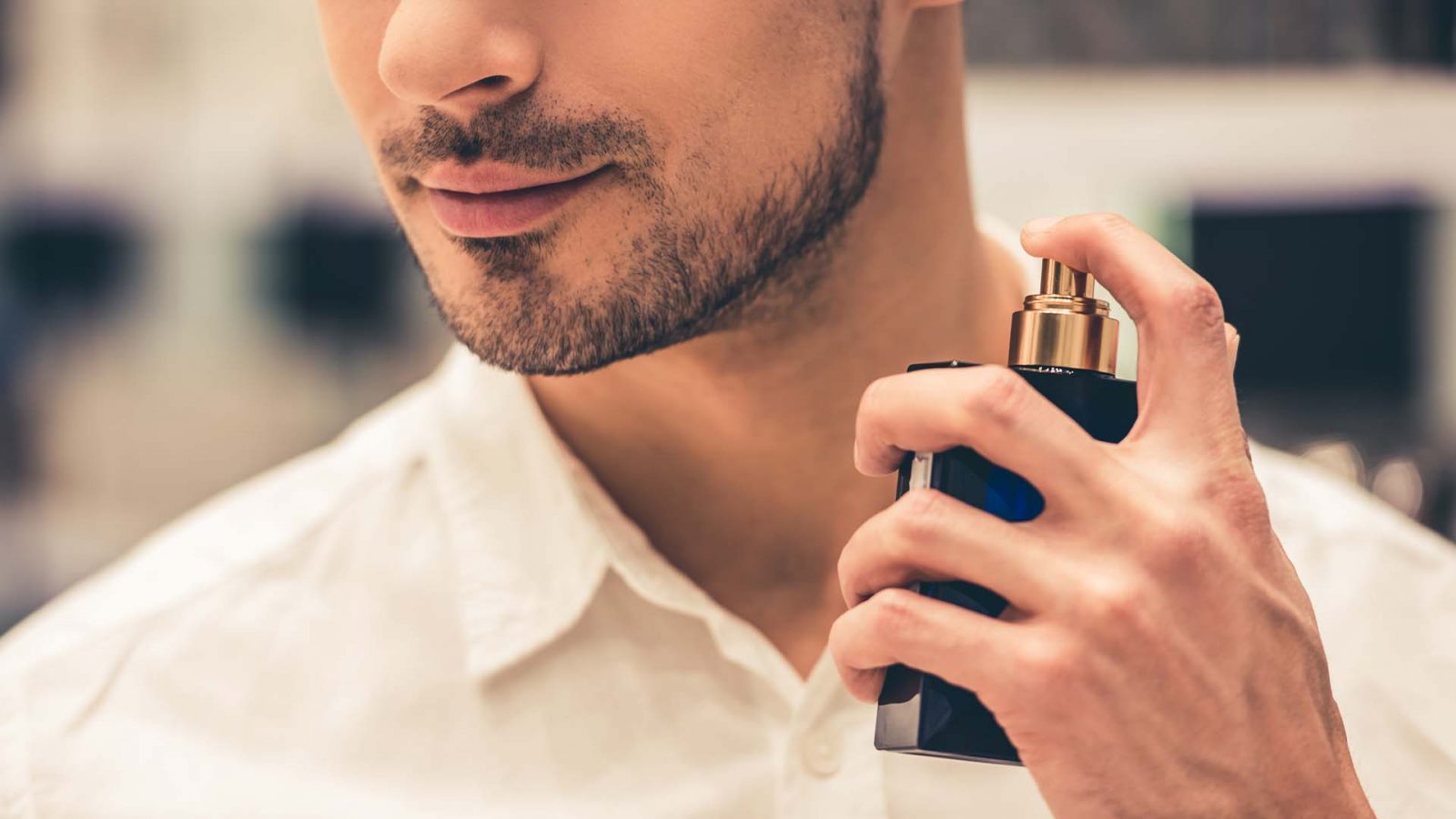 Man spraying perfume