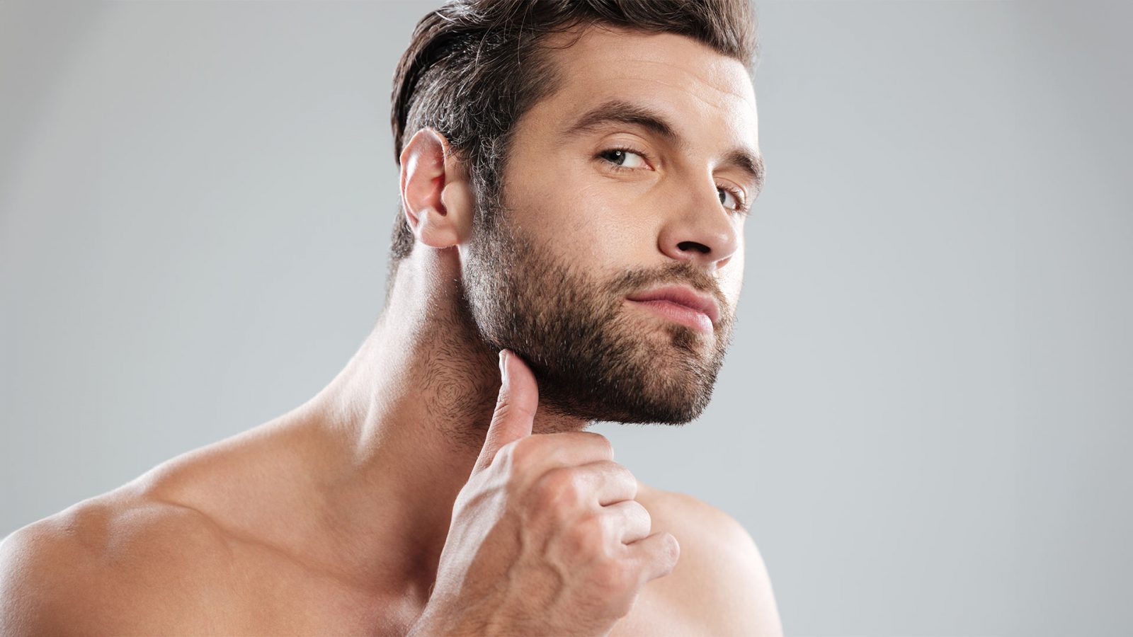 Man checking his beard out