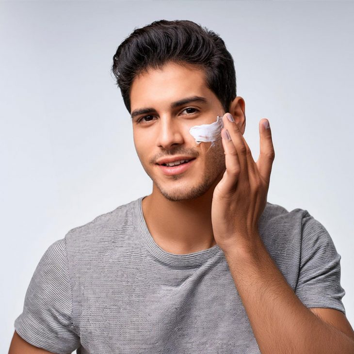 Man cleansing his face