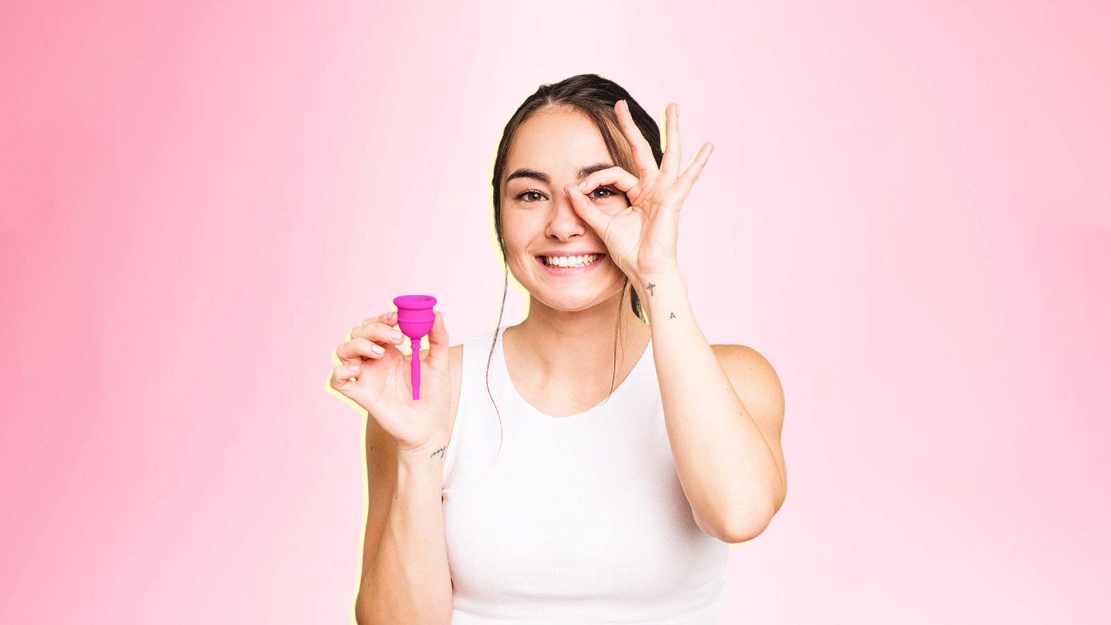 Woman holding a menstural cup