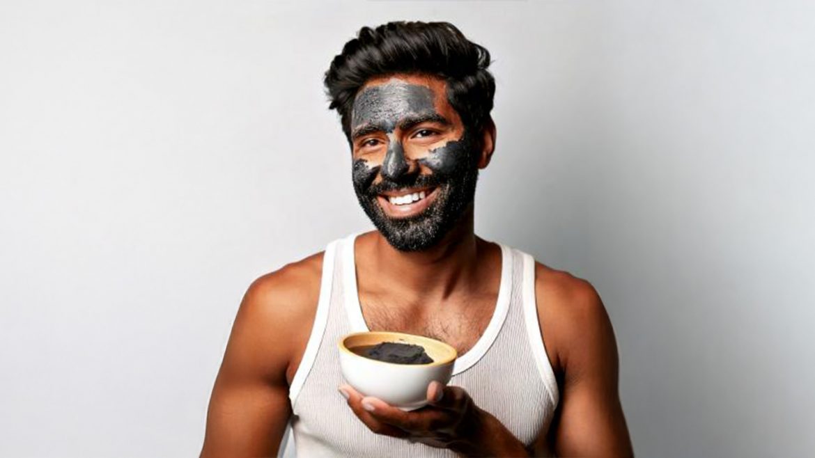 Man with charcoal face mask on