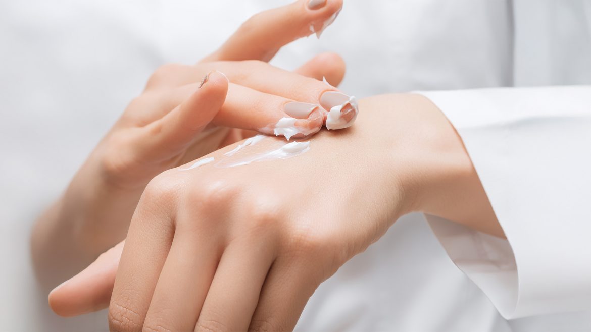 Woman applying lotion in circular motions