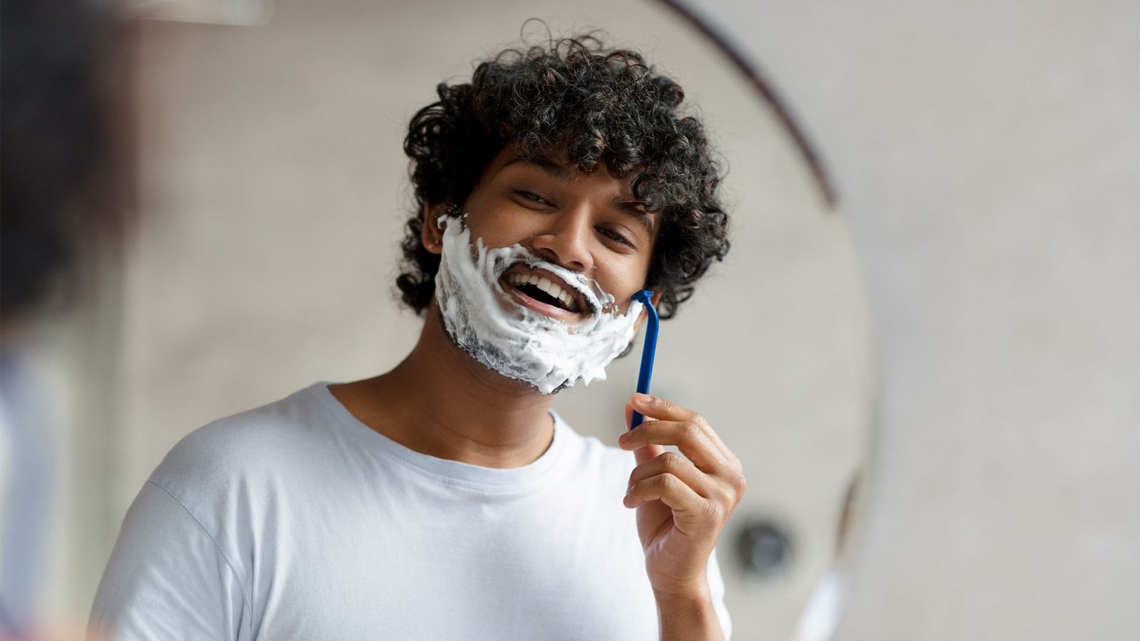 Man shaving his beard